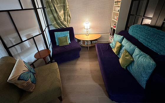 The new spa waiting room, with soft seating and warm lamplight
