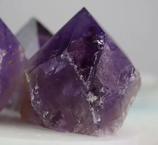 Raw amethyst points catching the light