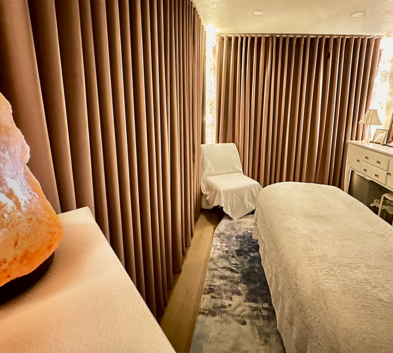 A calm massage treatment room at Divine Wellness, Winter Garden, FL